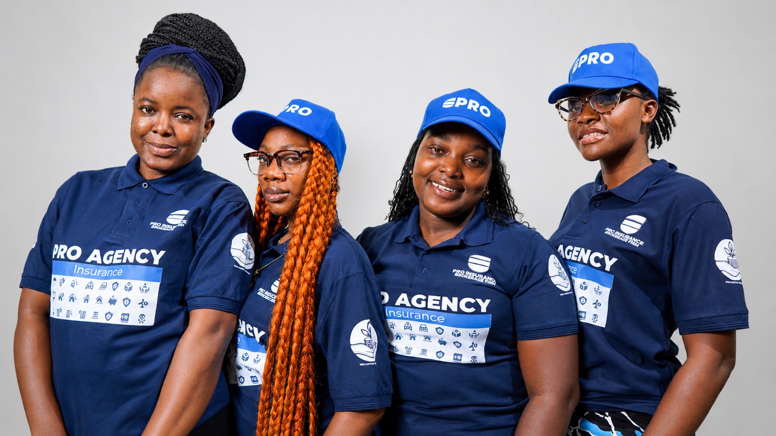 The Pro-Insurance Brokerage Firm team in branded uniform at the firm's Monrovia office