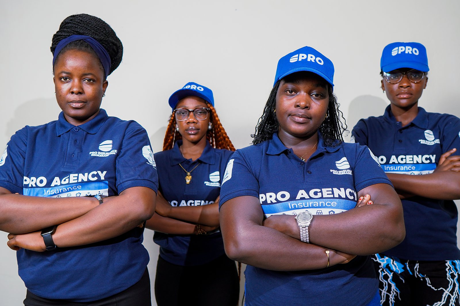 The Pro-Insurance Brokerage Firm team in branded uniform at the firm's Monrovia office